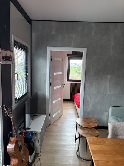 Tweedehands woonunit 26m² (8x3,2m) - 1 slaapkamer (links) - RO